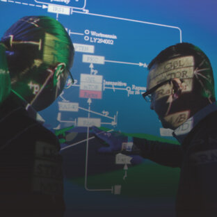 Researchers at Harvard Medical School discuss cellular pathways.